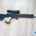Detailed side view of a diy cardboard sniper rifle (psg-1), built for realism with layered cardboard and paint.