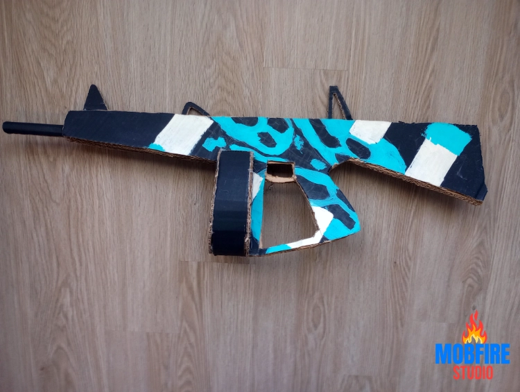 Back view of homemade cardboard AA-12 showcasing handle and detail work